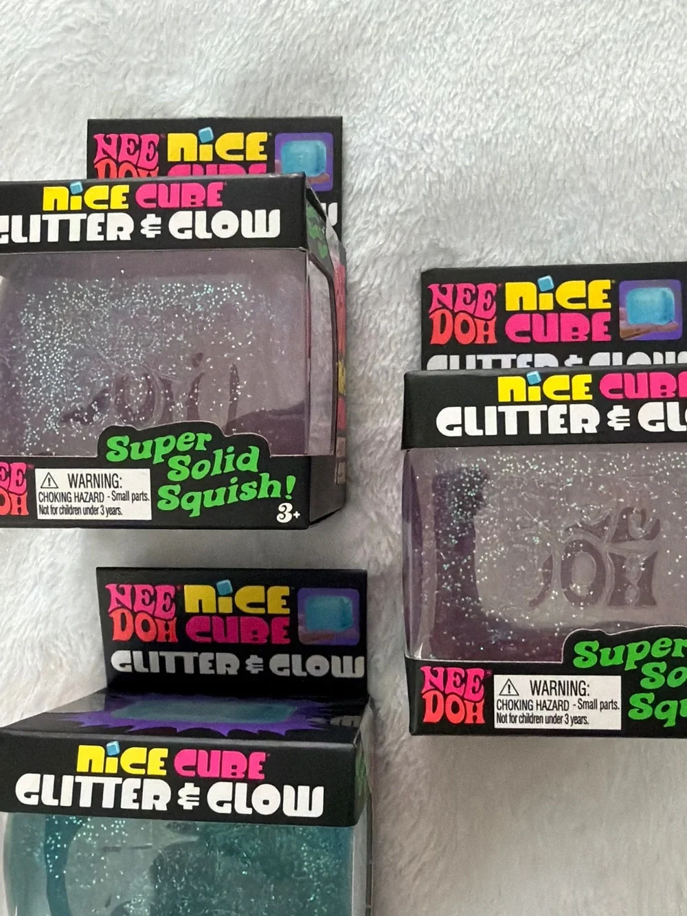 Set of Needoh Nice Cube Glitter & Glow Squishy Toys - Purple and Blue